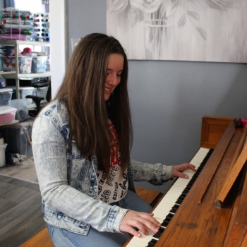 Arelis playing piano