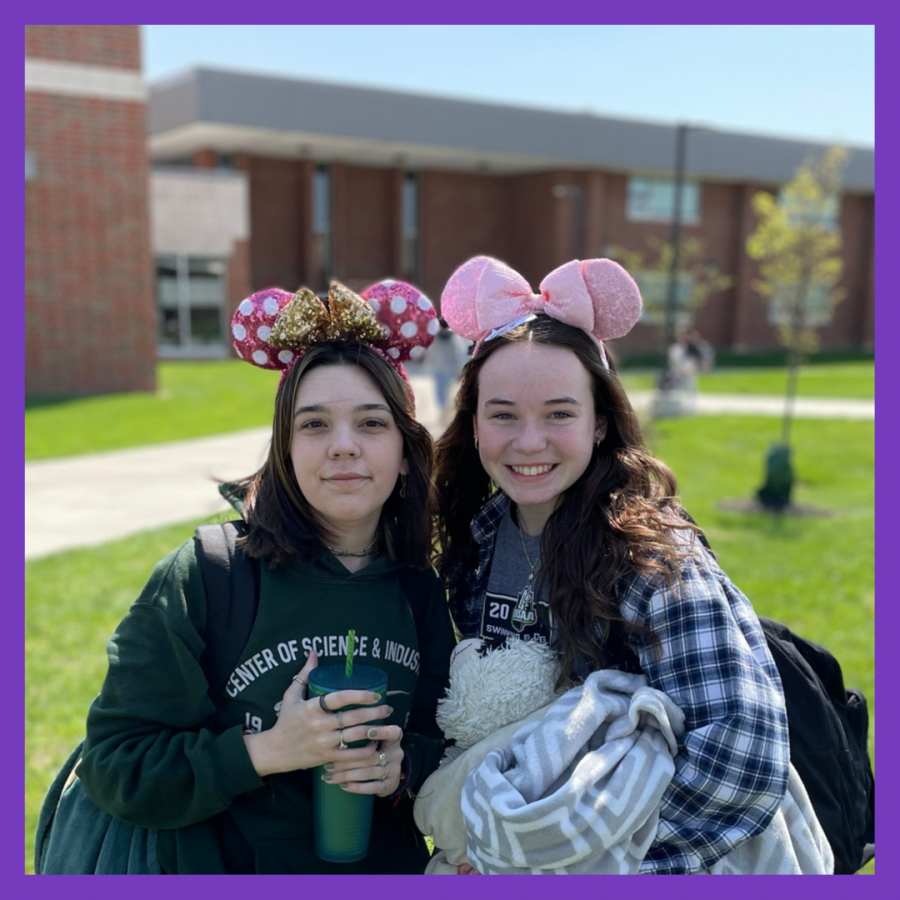 Two HS girls wearing Mickey Mouse ears