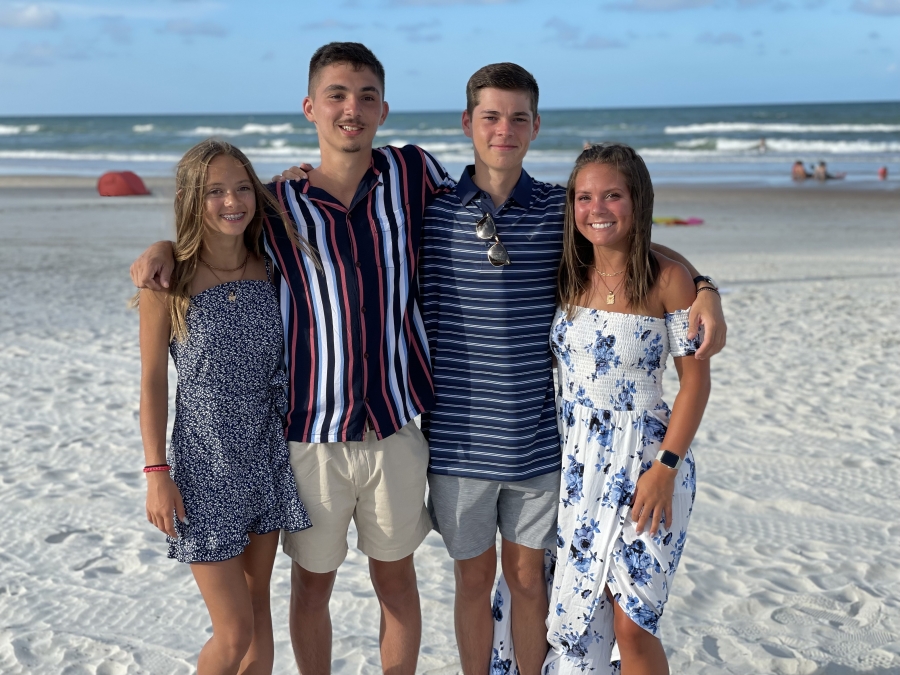 Becky Milton's four children on a beach