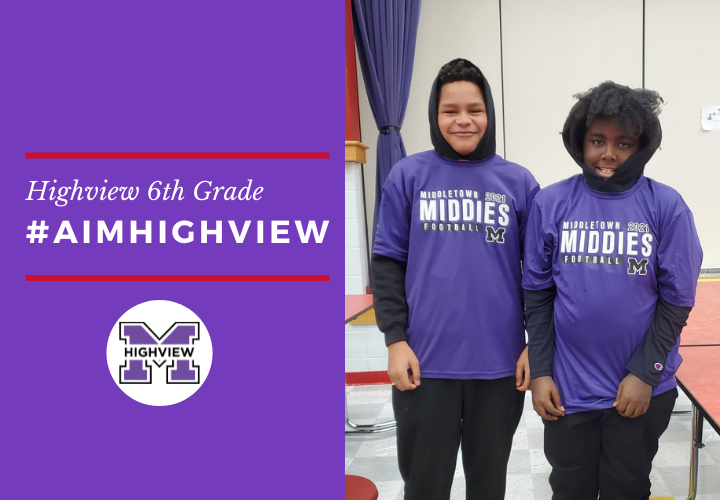 Two male students in matching purple